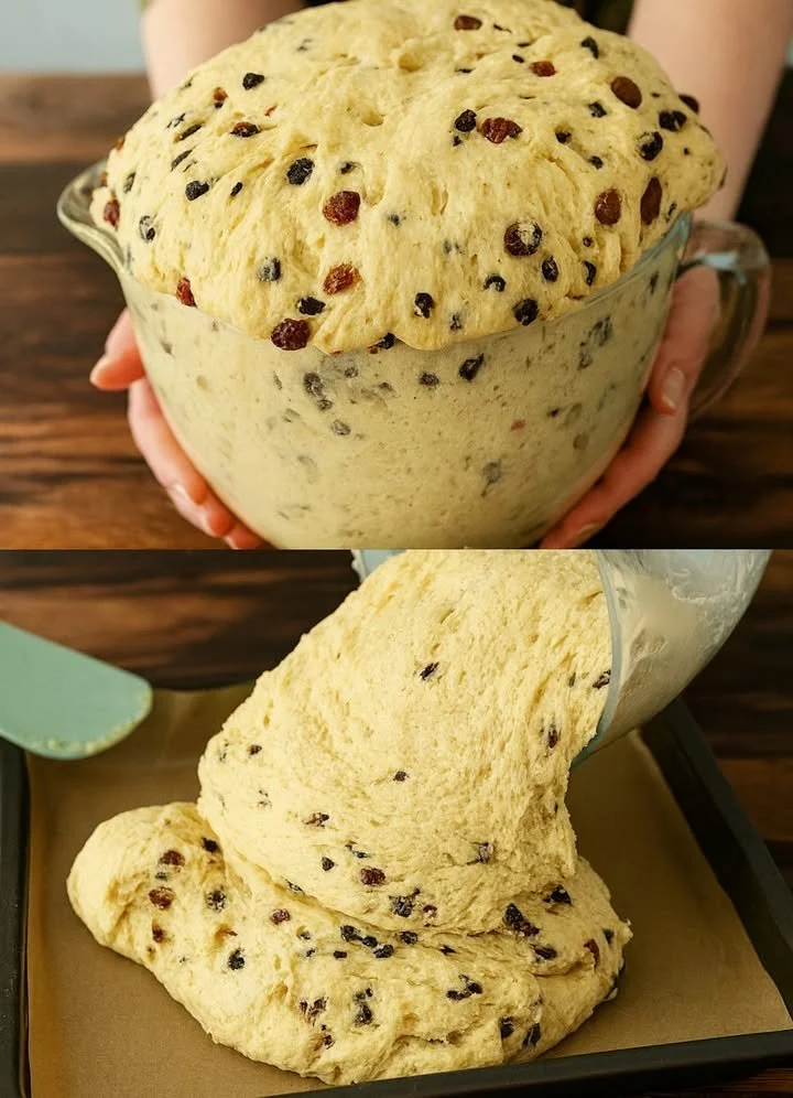 Leckerer Butterstollen mit Trockenfrüchten und Mandeln auf einem Tisch.