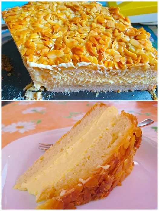 Bienenstich Kuchen mit Mandeln und Vanillecreme auf einem Teller.