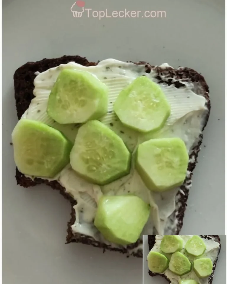 Brot mit Frischkäse und frischen Gurkenscheiben auf einem Teller