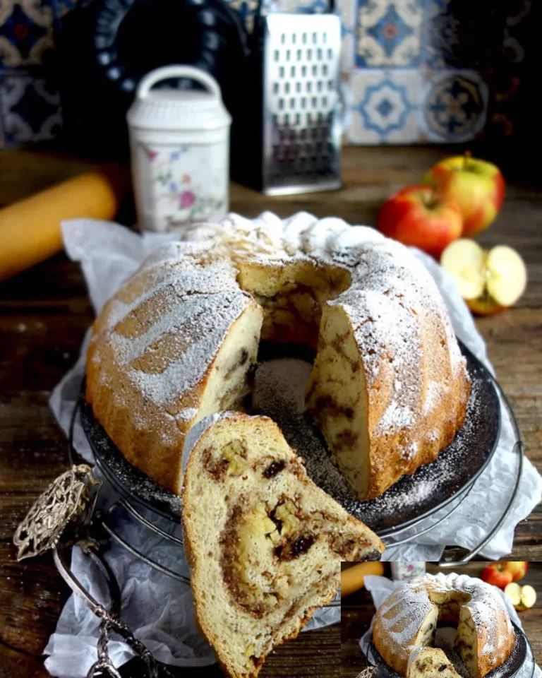 Hefe-Gugelhupf mit Äpfeln und Mandeln auf einem Kuchenplateau