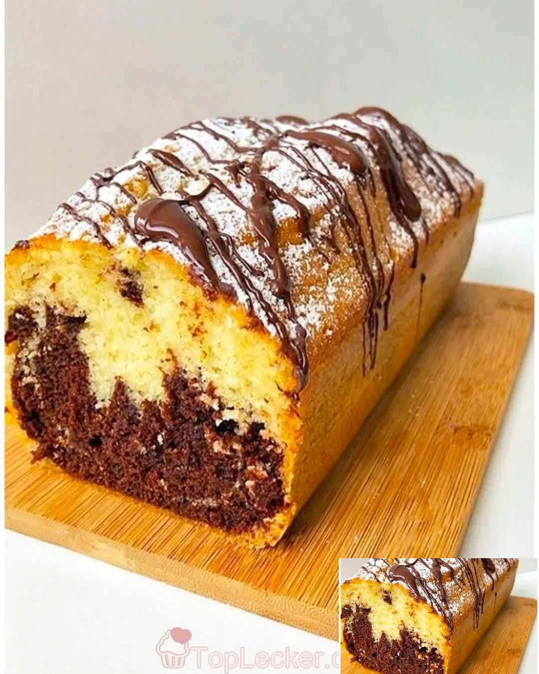 Leckere Scheiben Marmorkuchen auf einem Hintergrund von frischen Zutaten