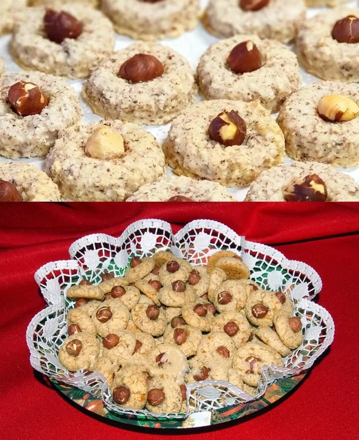 Deluxe Nussmakronen auf einem Teller, mit Nüssen und Schokolade dekoriert.