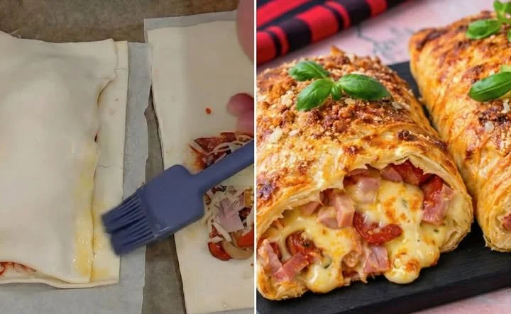 Blätterteig-Calzone gefüllt mit Salami und Käse auf einem Holzbrett.